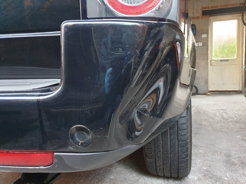 Cracked and large dent to 
Range Rover bumper